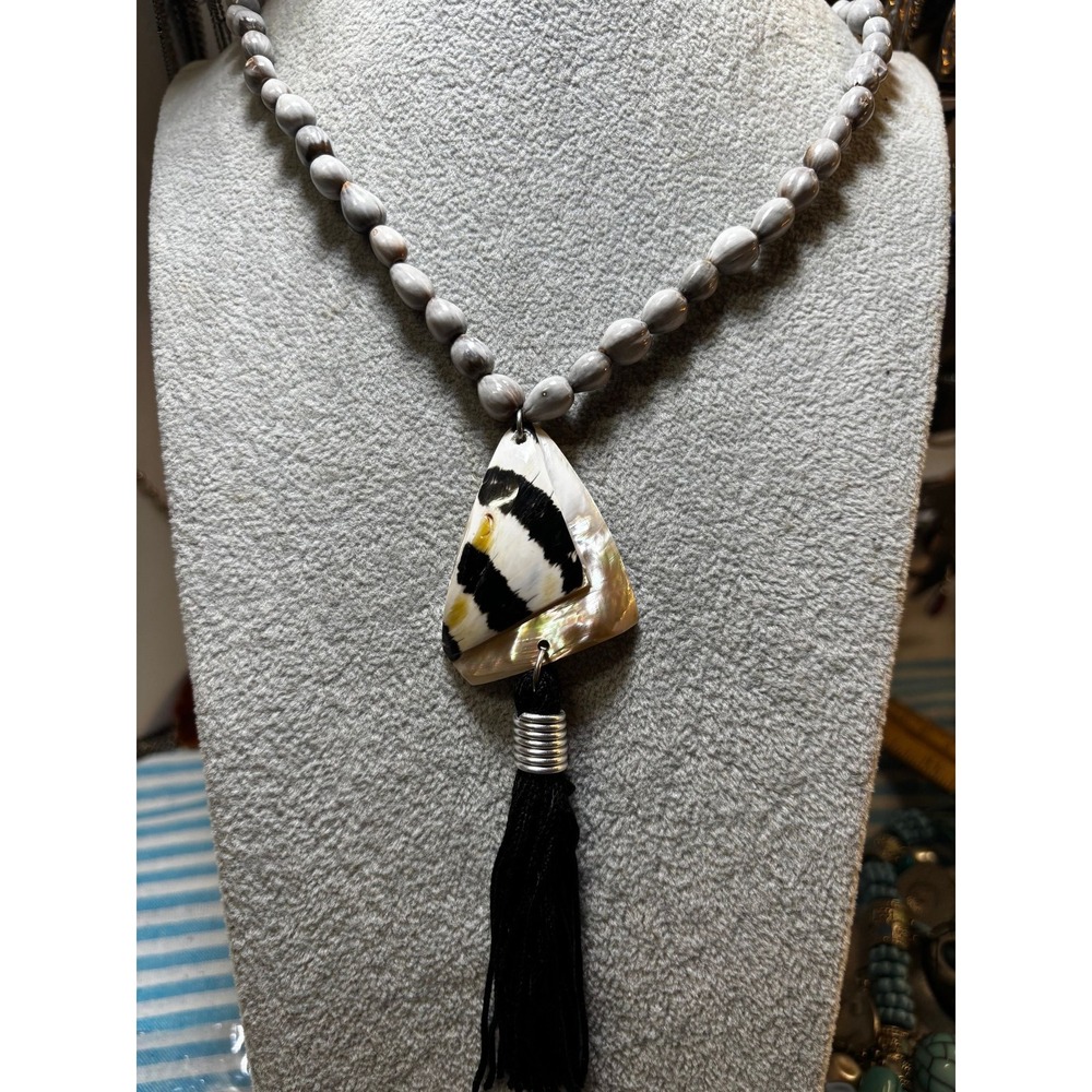 #7. Boho Elegance: Handcrafted Shell & Tassel Statement Necklace